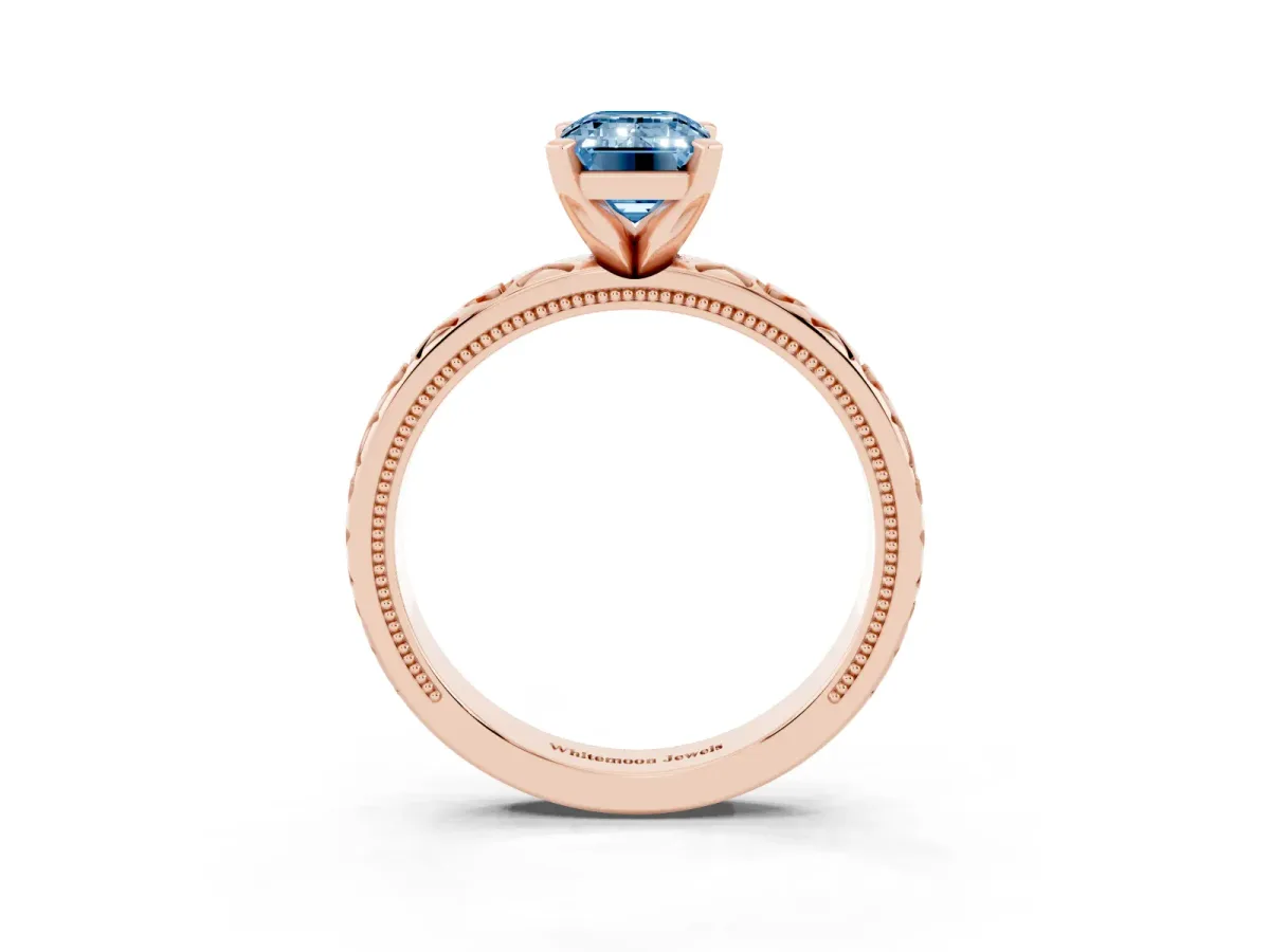 Fancy Blue Emerald Cut Solitaire Diamond Engagement Ring with XO Engraved Band and Four-Prong Setting Rose gold