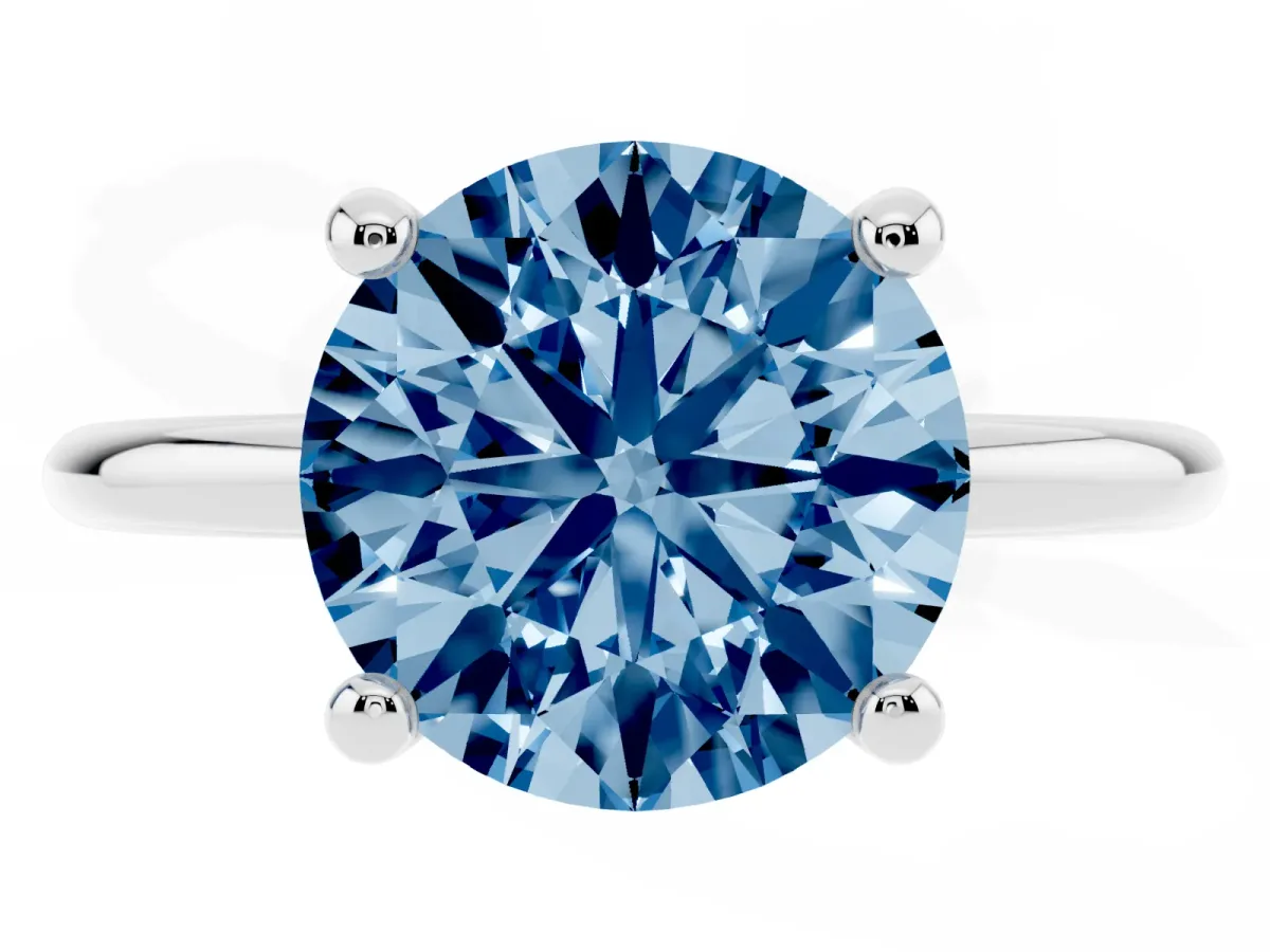 Fancy Blue Round Cut Solitaire Diamond Ring with 4-Prong Setting on a Classic Band Silver