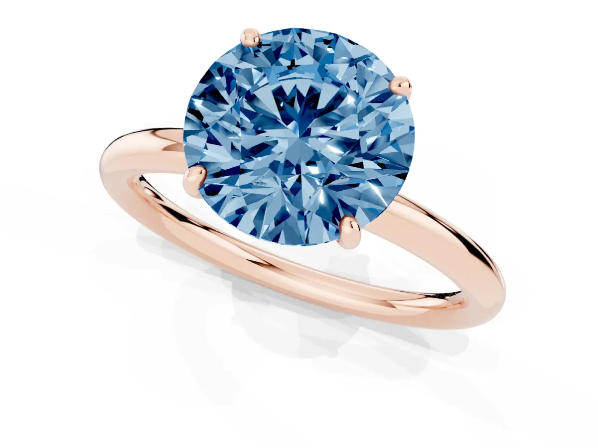 Fancy Blue Round Cut Solitaire Diamond Ring with Four-Prong Setting on a Plain Band Rose gold