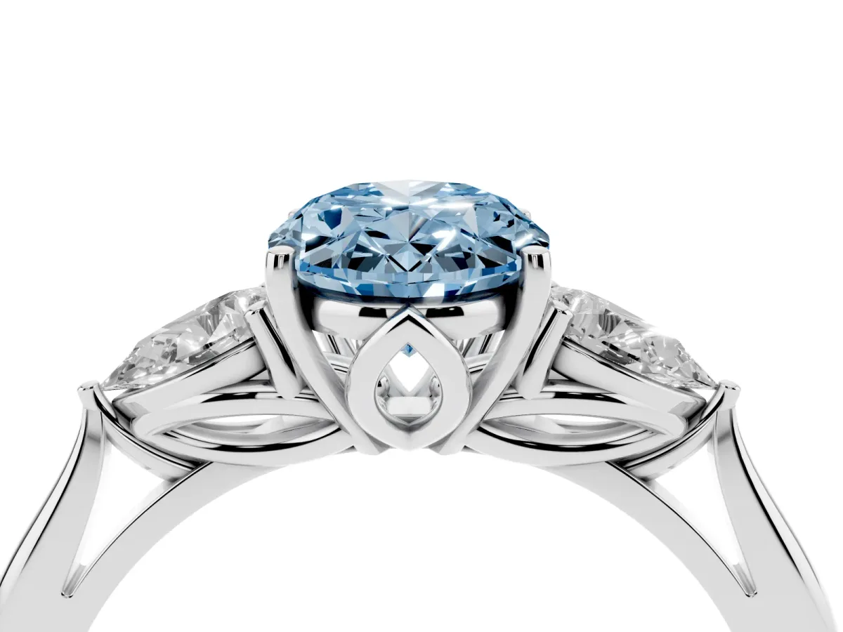 Fancy Blue Three-Stone Oval Cut Diamond Ring with Pear Side Stones in Four-Prong Setting Silver