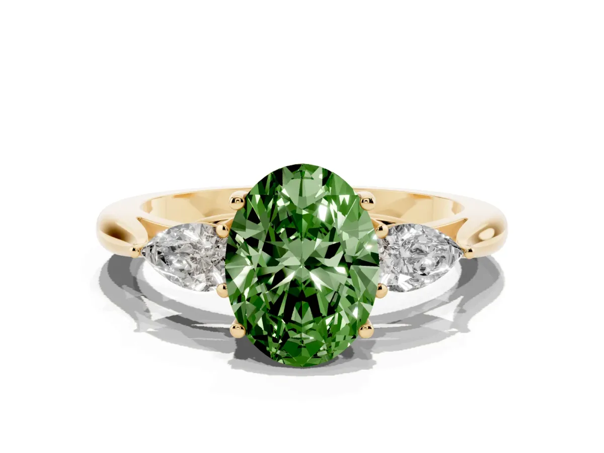 Fancy Green Three-Stone Oval Cut Brilliant Diamond Solitaire Ring with Tapered Band and Four-Prong Setting Yellow gold