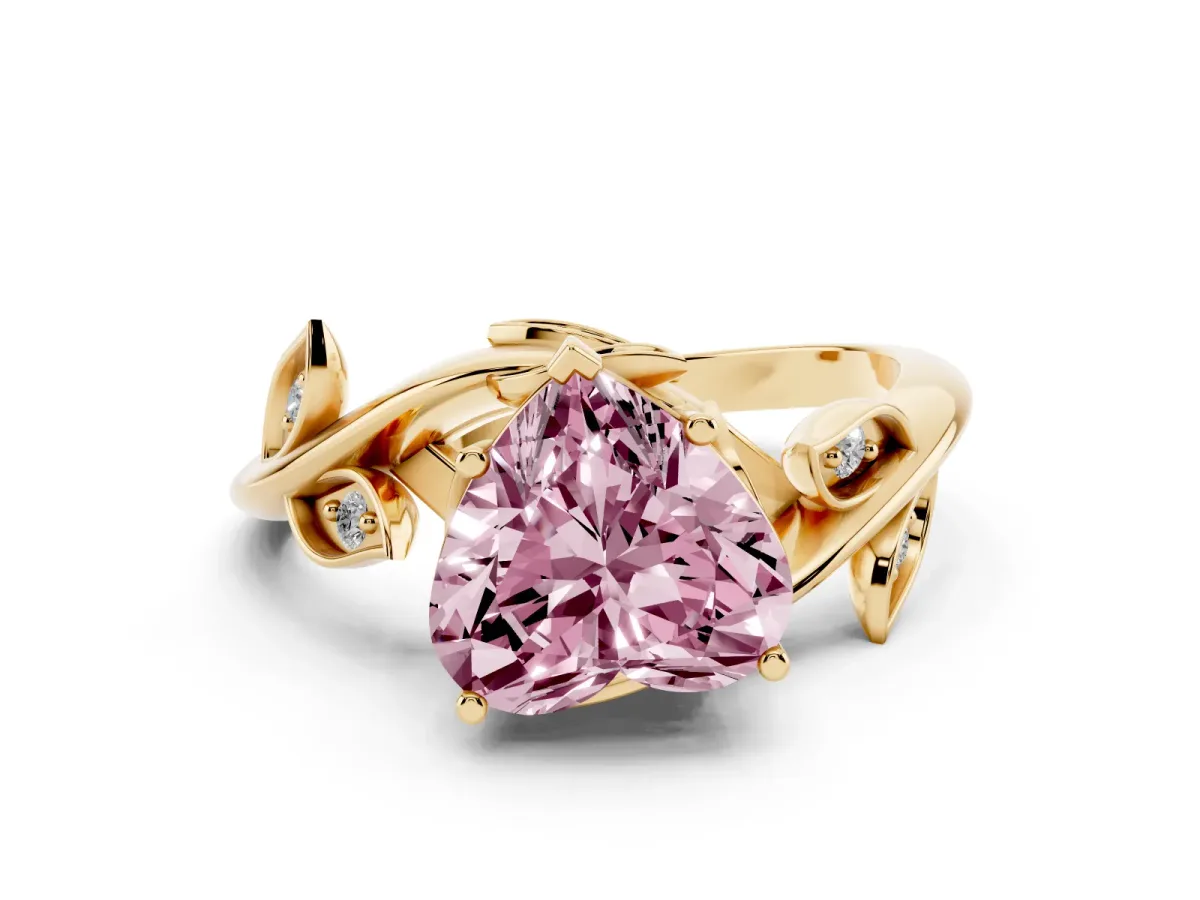 Fancy Pink Heart Cut Solitaire Twist Engagement Ring with Leaf Accents and Prong Setting Yellow gold