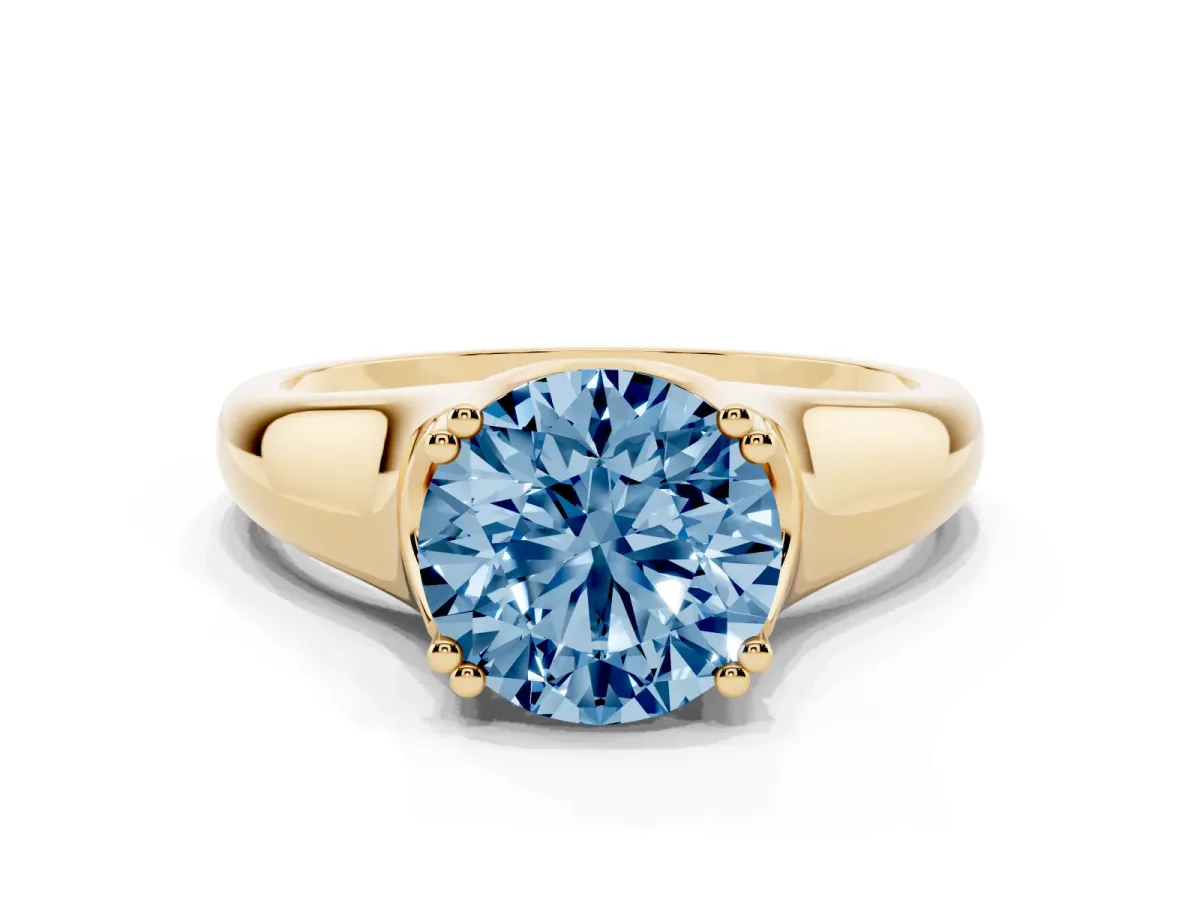 Fancy Blue Round Cut Diamond Solitaire Ring with Wide Band and Prong Setting Yellow gold