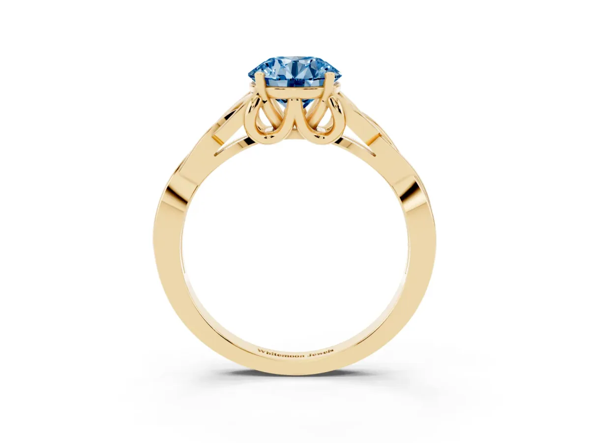 Fancy Blue Round Cut Diamond Solitaire Engagement Ring with Celtic Knot Band and Four-Prong Setting Yellow gold