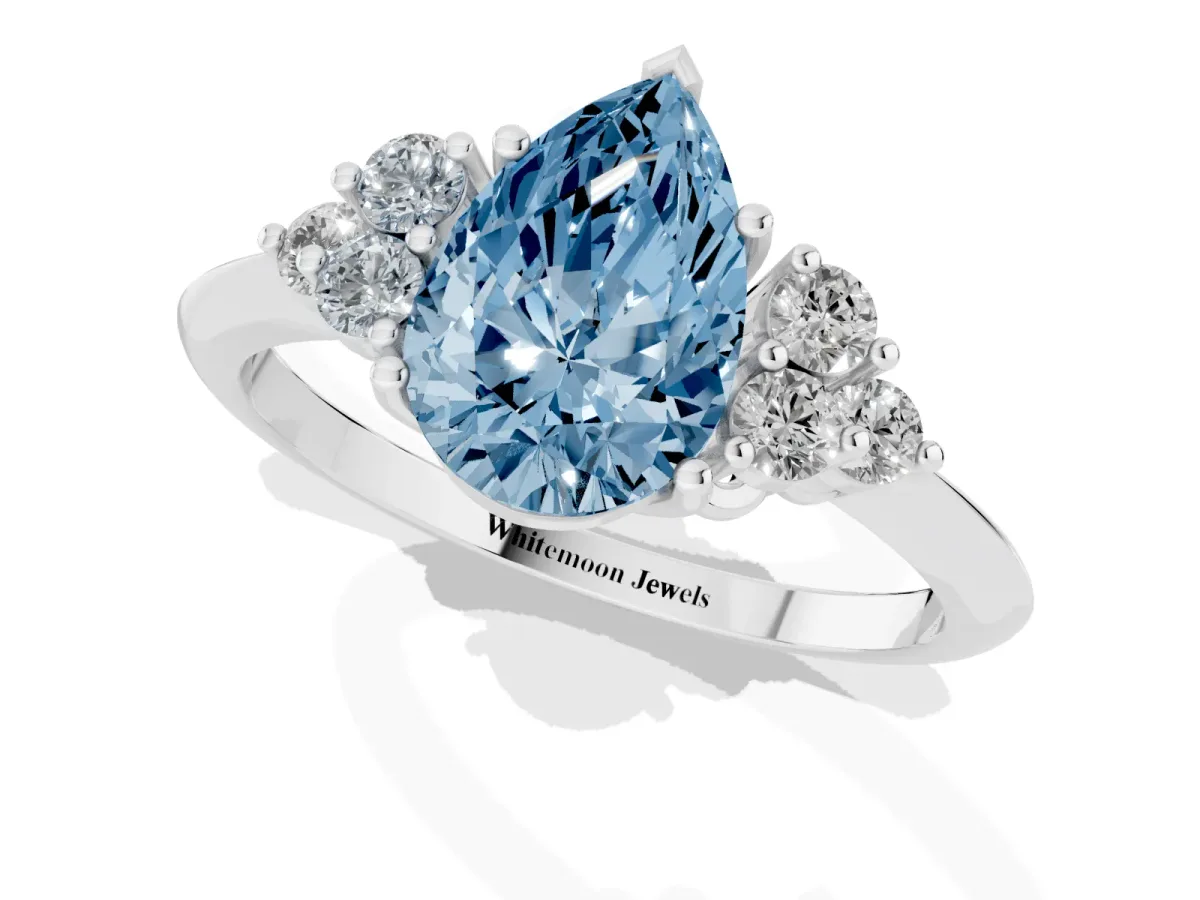 Fancy Blue Pear Cut Cut Diamond Cluster Ring with Solitaire Band and Four-Prong Setting Silver