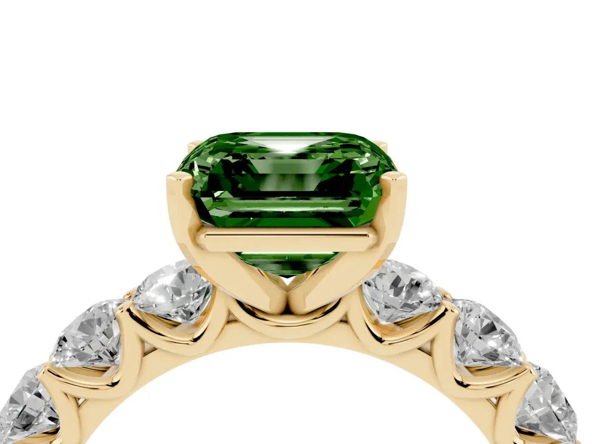 Fancy Green Asscher Cut Diamond Prong Setting with Side Stones on a Pave Band Yellow gold