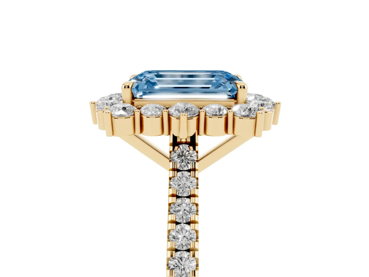 Fancy Blue Emerald Cut Halo Diamond Ring with Pavé Band and Prong Setting Yellow gold