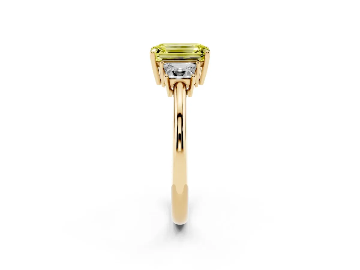 Fancy Yellow Emerald Cut Diamond Three-Stone Ring with Trapezoid Side Stones and Prong Setting Yellow gold