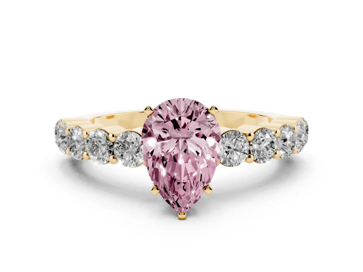 Fancy Pink Pear Cut Diamond Solitaire Ring with Shared Prong Round Side Stones Yellow gold