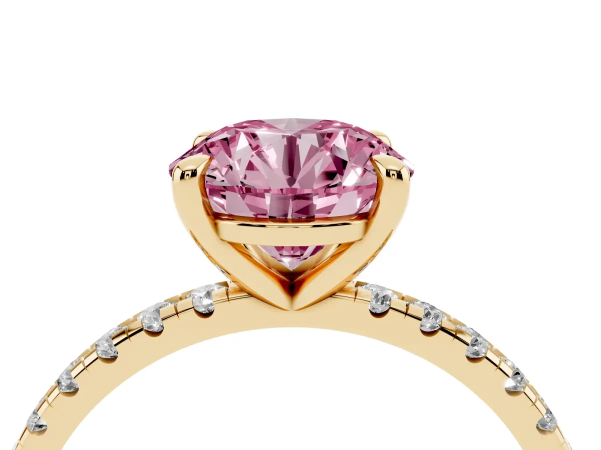 Fancy Pink Round Cut Diamond Brilliant Solitaire Ring with Pavé Band and Four-Prong Setting Yellow gold