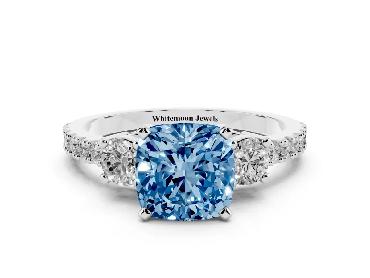 Fancy Blue Cushion Cut Three-Stone Diamond Pavé Band with Prong Setting Platinum