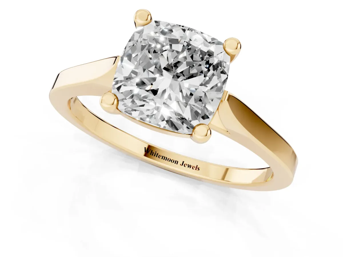 Cushion Cut Solitaire Diamond Ring with Four-Prong Setting and Tapered Band Yellow gold