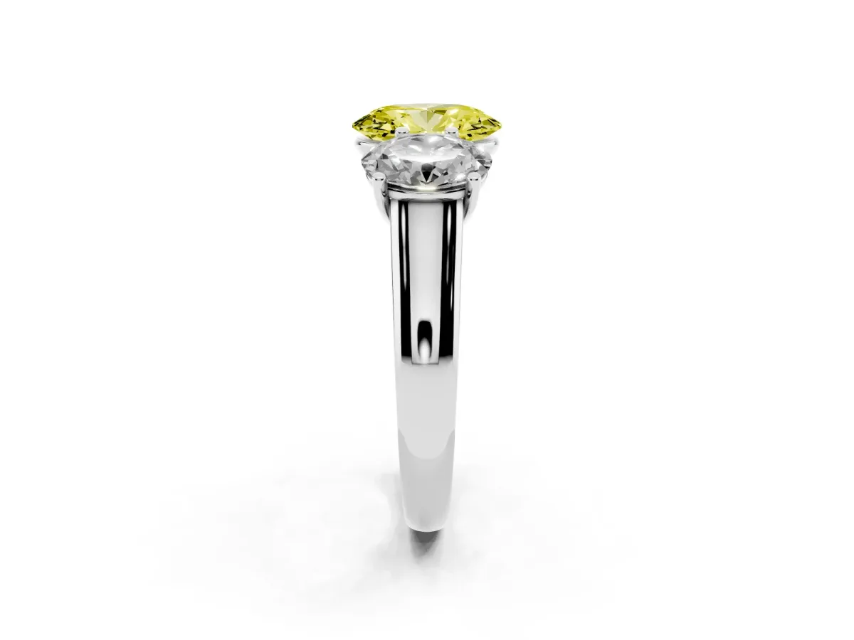 Fancy Yellow Oval Cut Three-Stone Diamond Ring with Prong Setting on a Classic Band Platinum