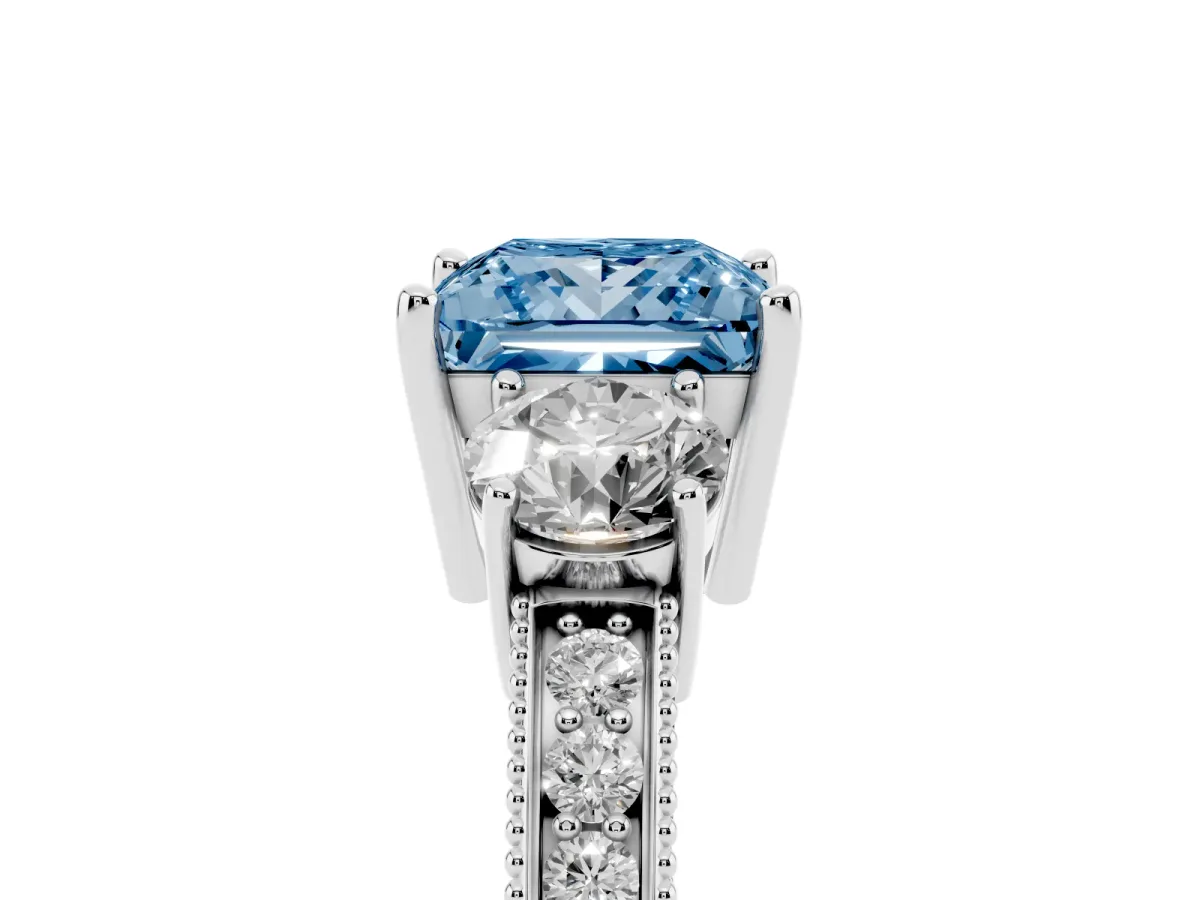 Fancy Blue Princess Cut Three-Stone Diamond Ring with Pavé Band and Four-Prong Setting Silver
