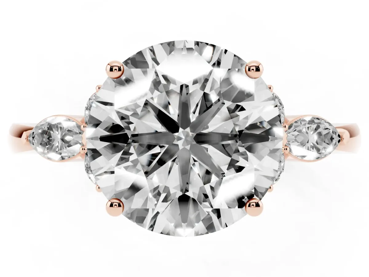 Round Cut Brilliant Diamond Solitaire Ring with Pear Side Stones and Four-Prong Setting Rose gold