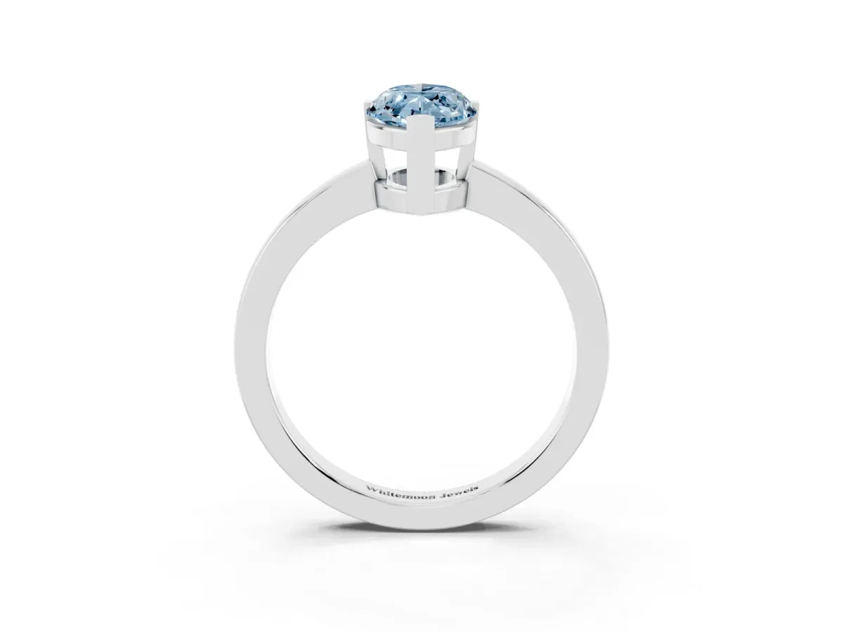 Fancy Blue Marquise Cut Cut Solitaire Ring with Four-Prong Setting and Classic Band Silver