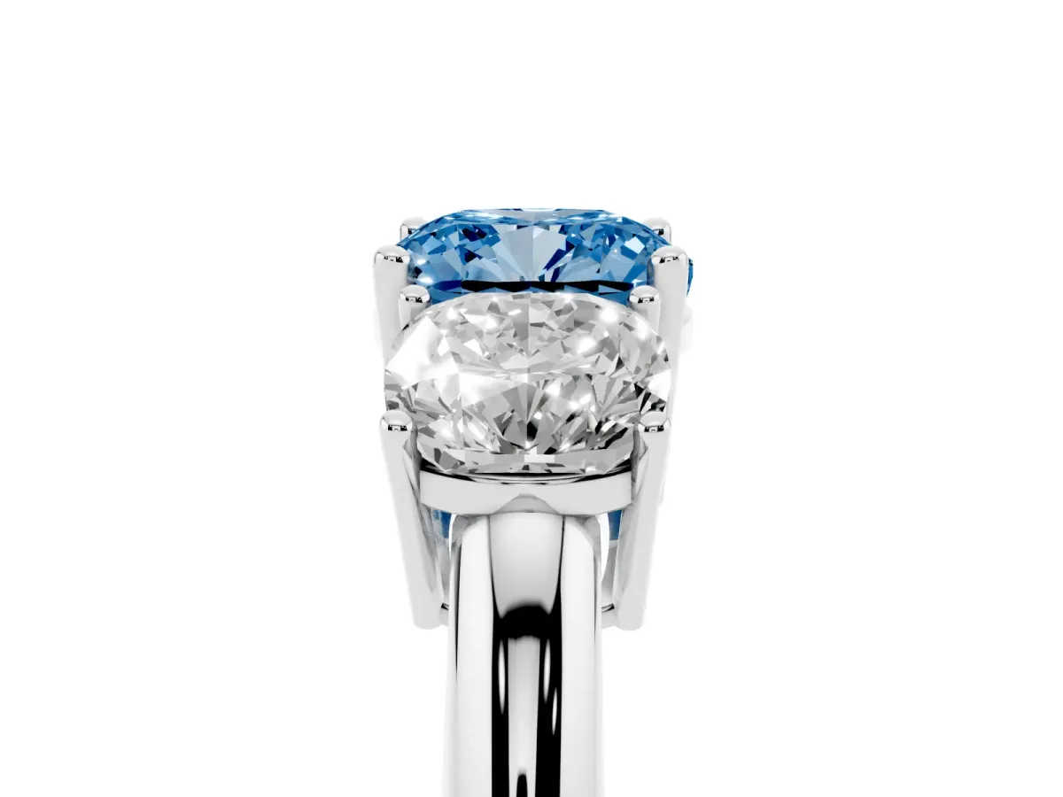 Fancy Blue Three-Stone Cushion Cut Cut Diamond Engagement Ring with Prong Setting on a White Gold Band Platinum