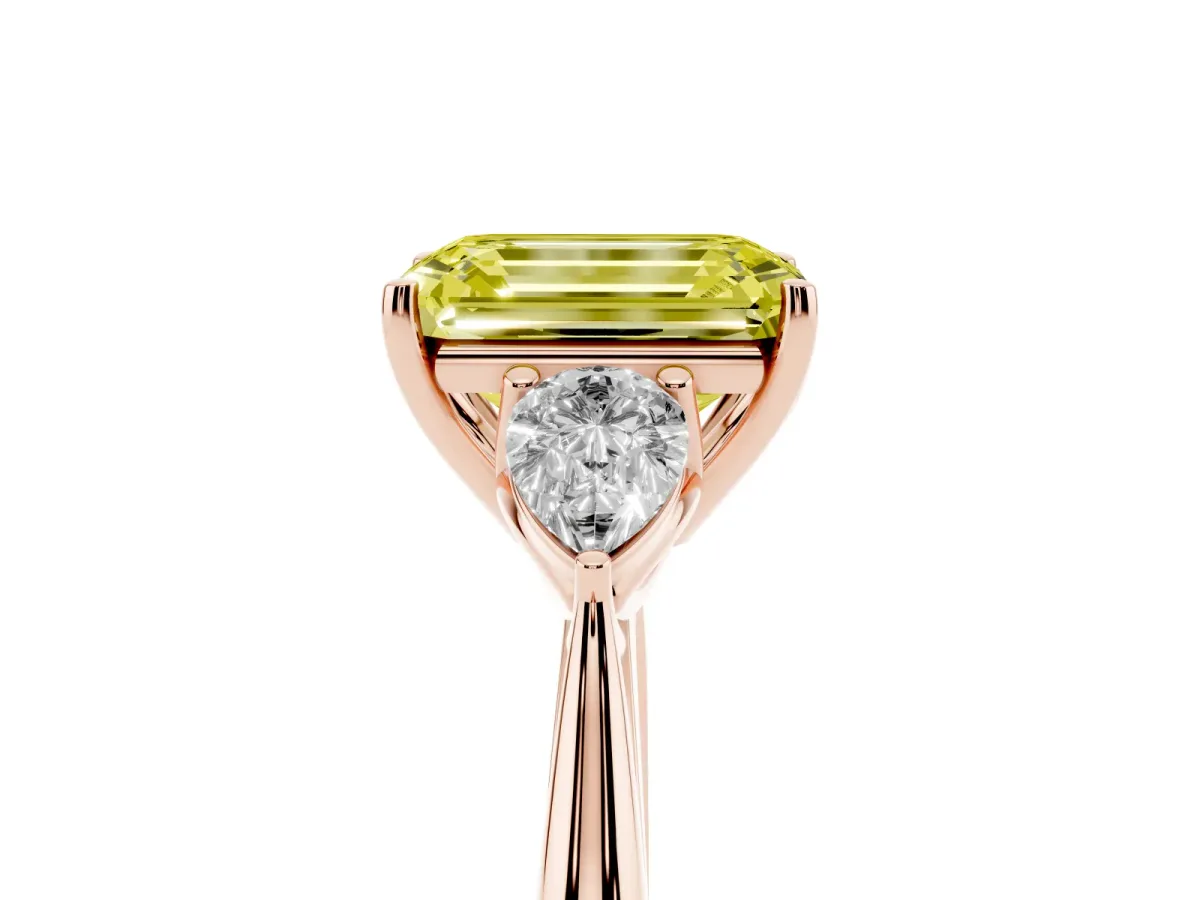 Fancy Yellow Three-Stone Emerald Cut Diamond Ring with Pear Side Stones in Four-Prong Setting Rose gold