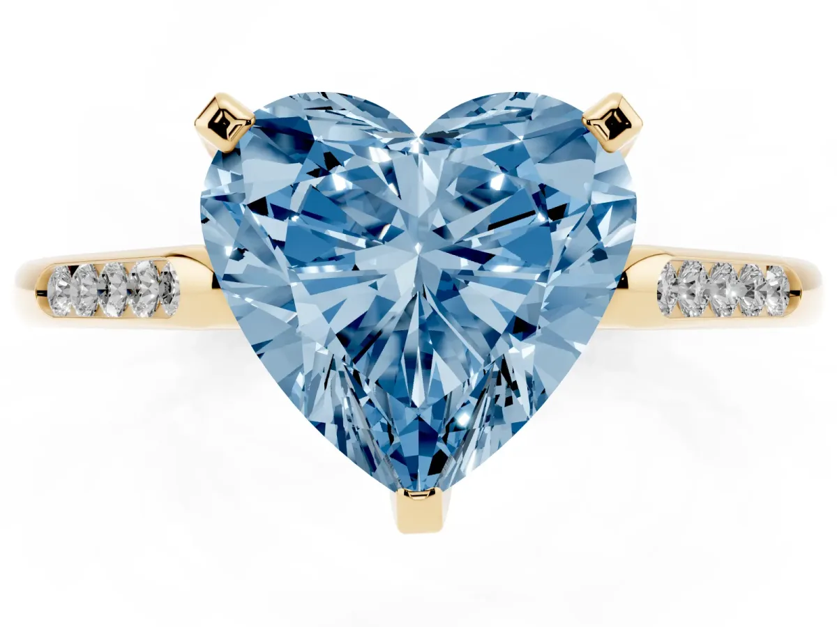 Fancy Blue Heart Cut Diamond Solitaire Ring with Channel Set Round Band and Prong Setting Yellow gold