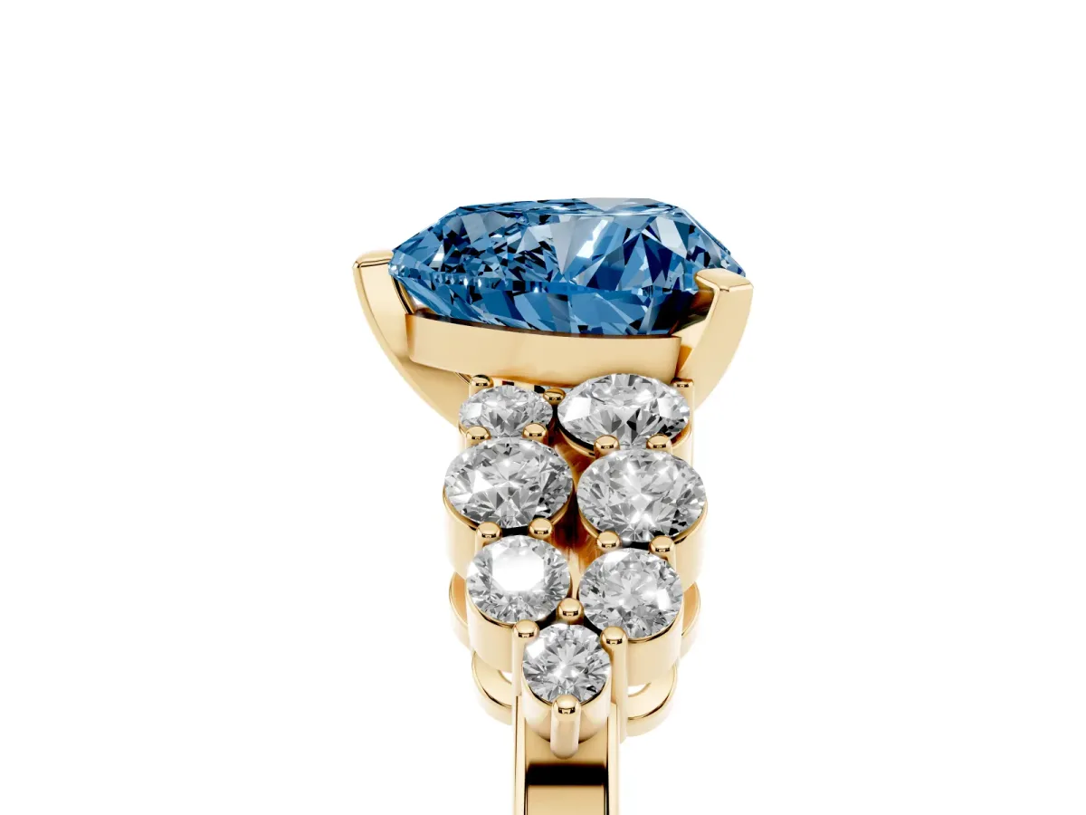 Fancy Blue Heart Cut Cluster Diamond Engagement Ring with Pavé Band and Four-Prong Setting Yellow gold