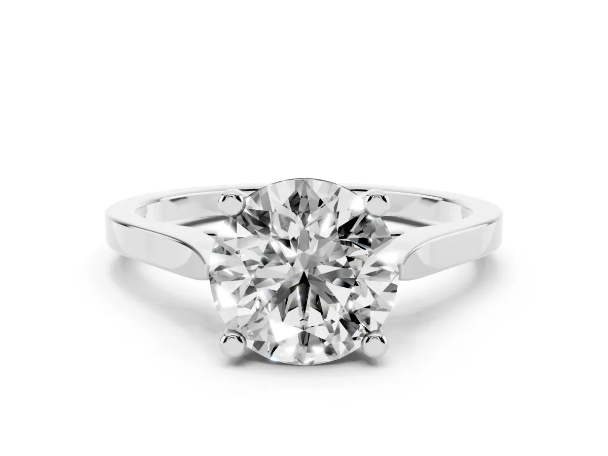 Round Cut Solitaire Diamond Ring with Four-Prong Setting and Tapered Band Platinum