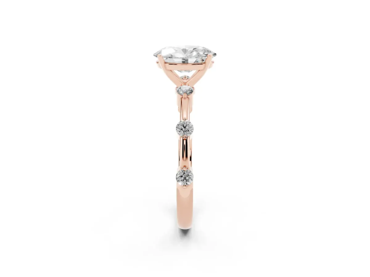 Oval Cut Solitaire Diamond Ring with Bezel Set Side Stones and Prong Setting Rose gold