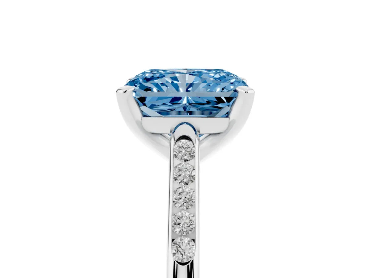 Fancy Blue Radiant Cut Diamond Solitaire Ring with Channel Set Round Band and Prong Setting Silver