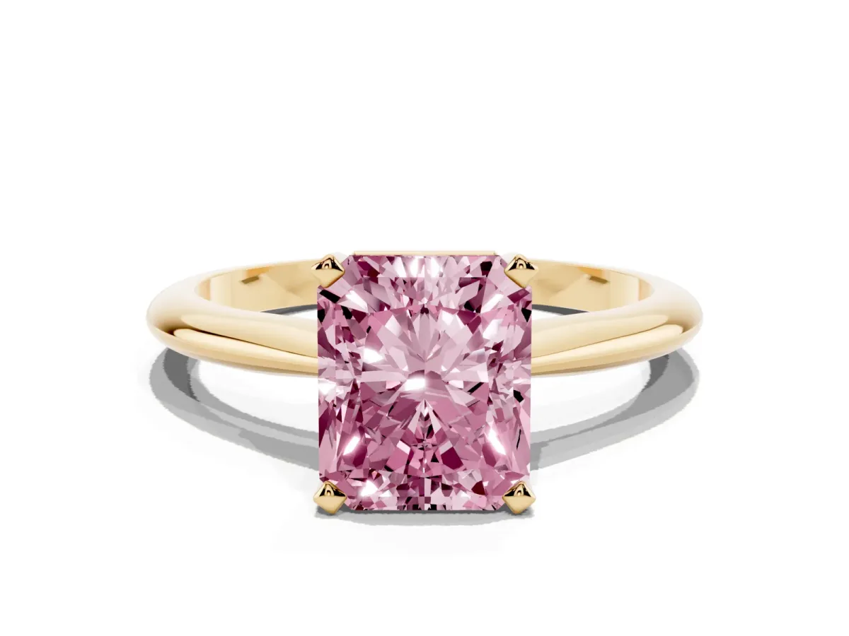 Fancy Pink Radiant Cut Cut Solitaire Ring with Four-Prong Setting on a Classic Band Yellow gold