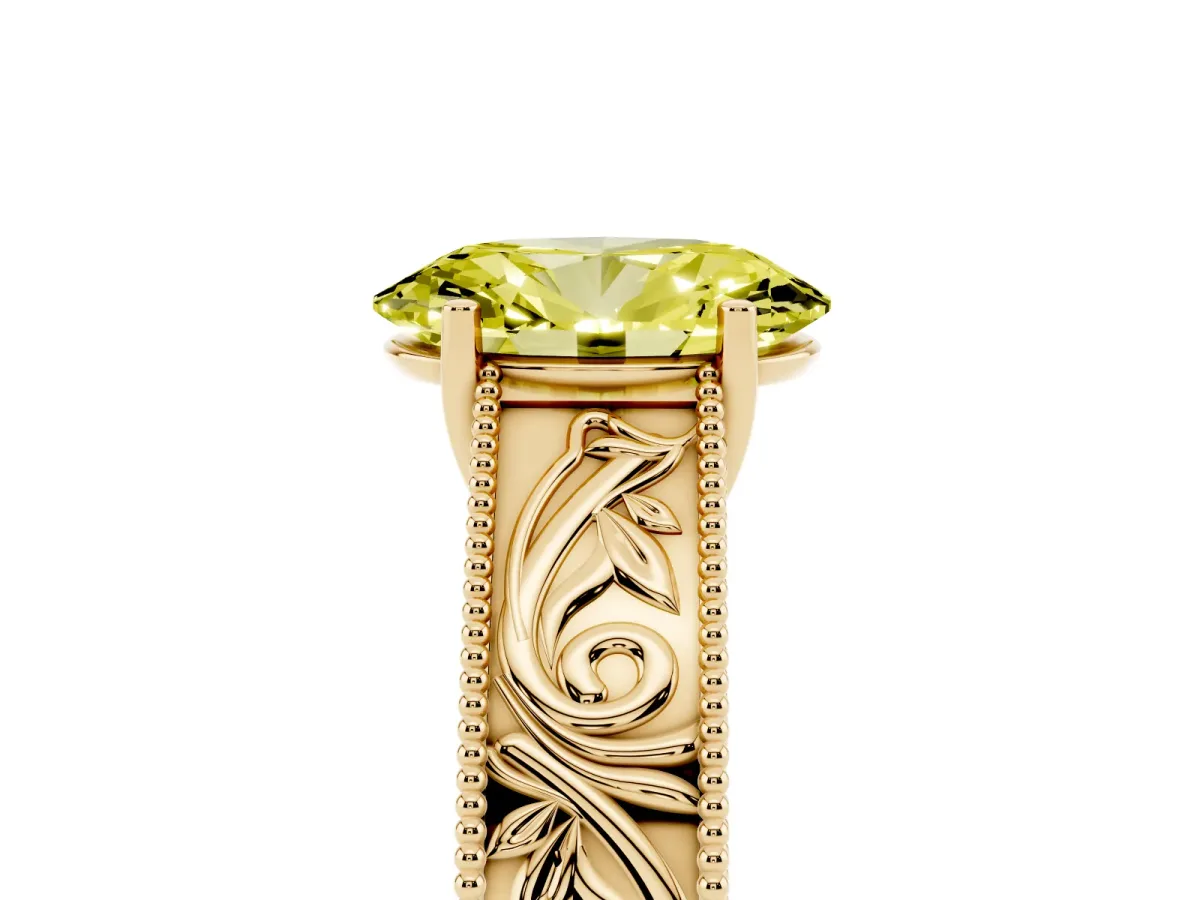 Fancy Yellow Oval Cut Diamond Solitaire Ring with Engraved Band and Four-Prong Setting Yellow gold