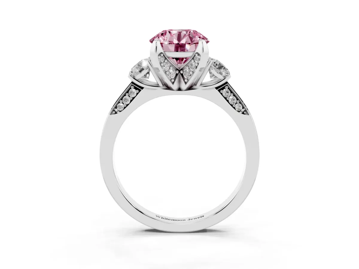 Fancy Pink Round Cut Brilliant Three-Stone Diamond Ring with Pavé Band and Four-Prong Setting White gold