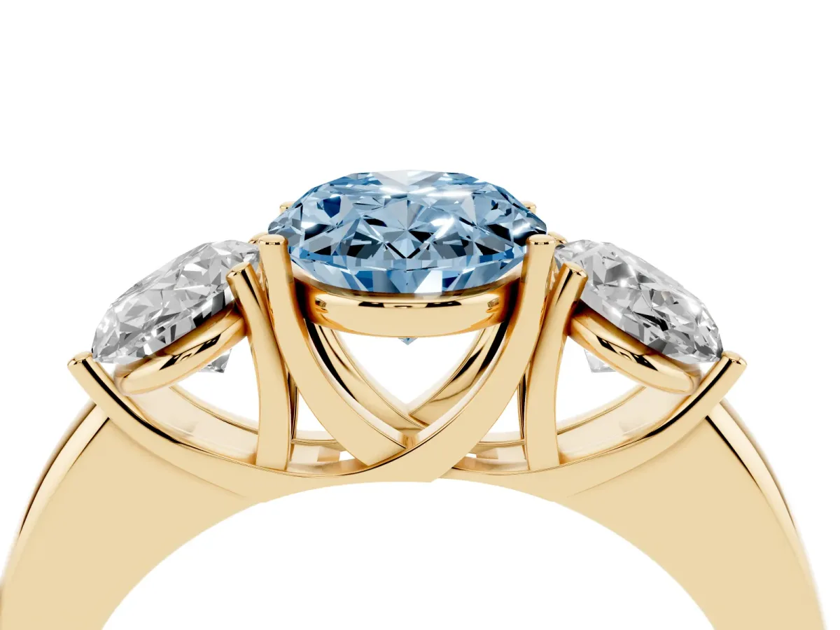 Fancy Blue Oval Cut Diamond Three-Stone Ring with Four-Prong Setting and Classic Band Yellow gold