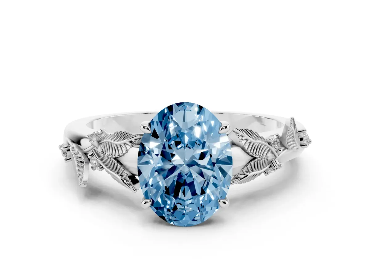 Fancy Blue Oval Cut Diamond Solitaire Ring with Leaf Motif Band and Four-Prong Setting Silver