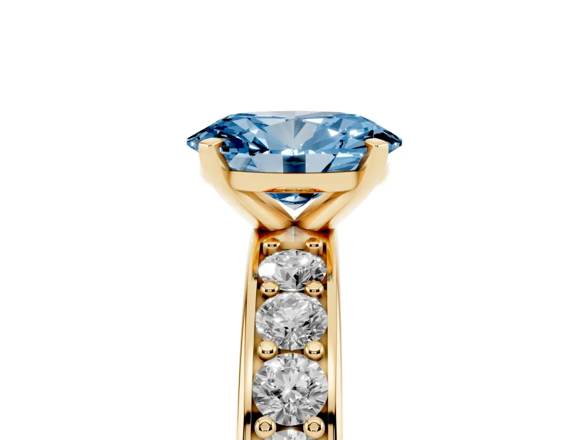Fancy Blue Oval Cut Diamond Engagement Ring with Channel Set Round Band and Prong Setting Yellow gold