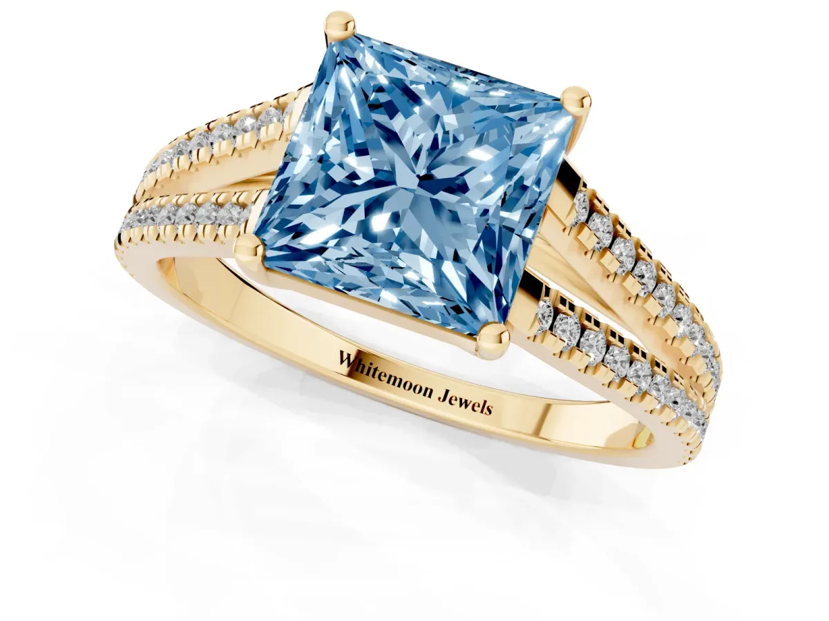 Fancy Blue Princess Cut Diamond Solitaire Engagement Ring with Split Shank Pavé Band Yellow gold