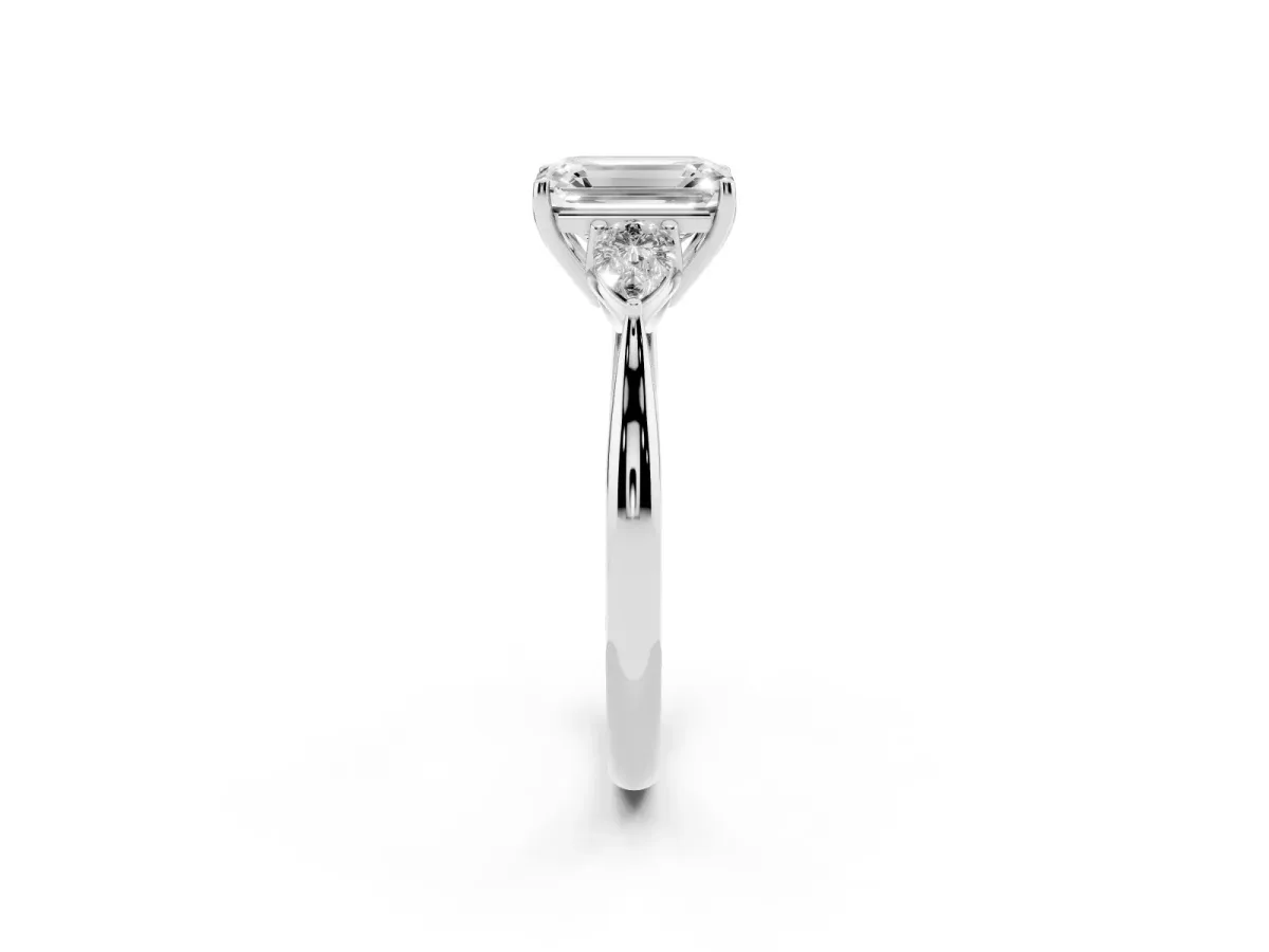 Three-Stone Emerald Cut Brilliant Diamond Solitaire Ring with Tapered Band and Four-Prong Setting Platinum