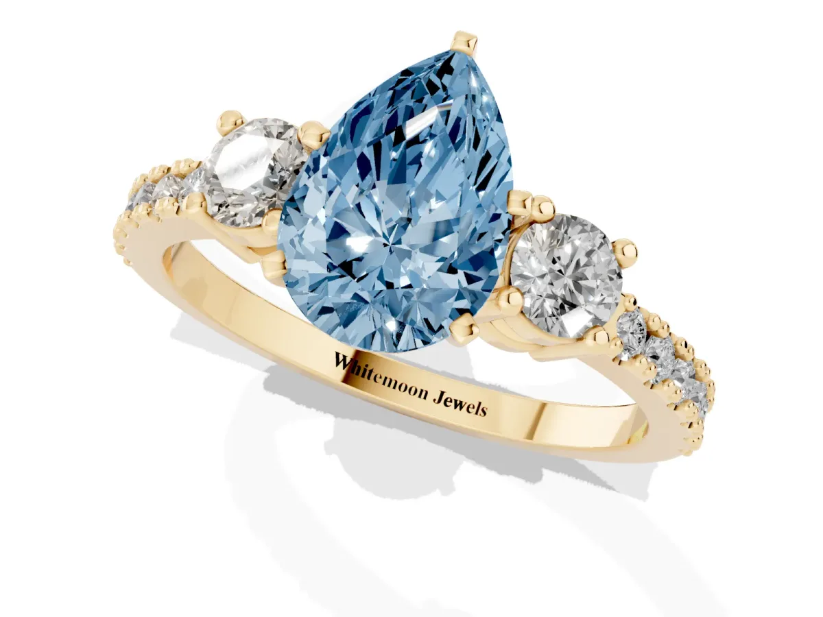 Fancy Blue Pear Cut Three-Stone Diamond Pavé Band with Prong Setting Yellow gold