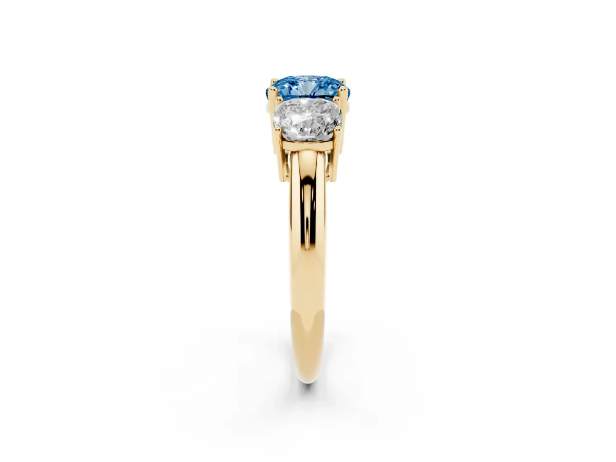 Fancy Blue Three-Stone Cushion Cut Cut Diamond Engagement Ring with Prong Setting on a White Gold Band Yellow gold
