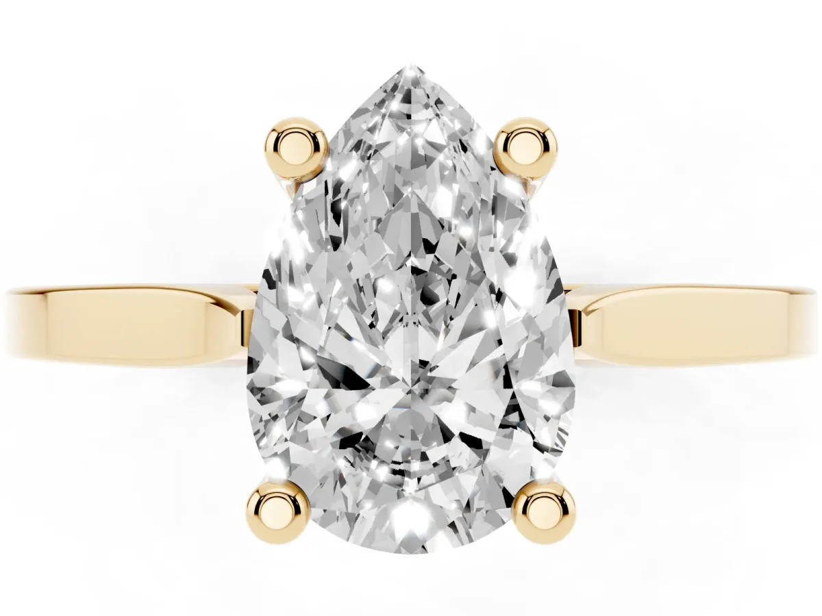 Pear Cut Solitaire Diamond Ring with Four-Prong Setting and Tapered Band Yellow gold