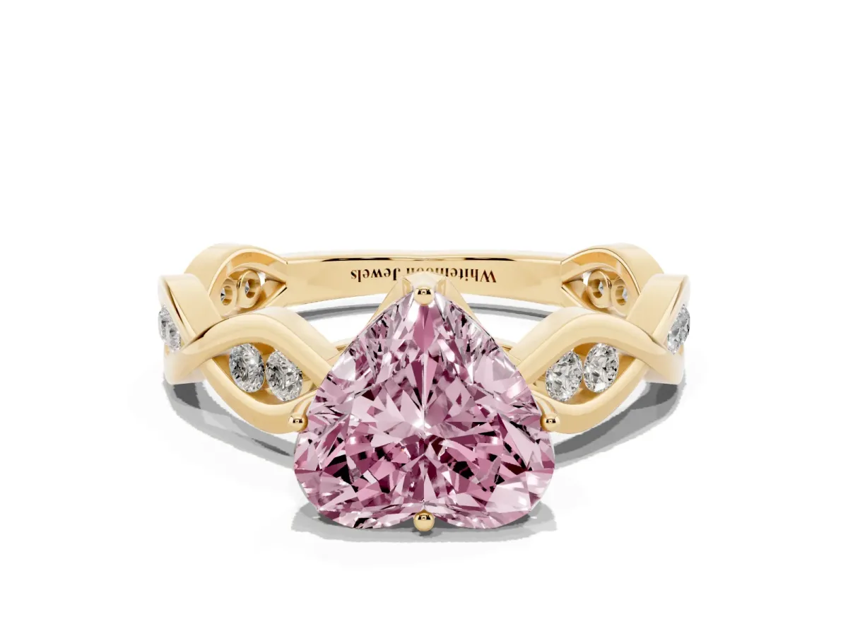 Fancy Pink Heart Cut Solitaire Twist Band with Leaf Prong Setting Yellow gold