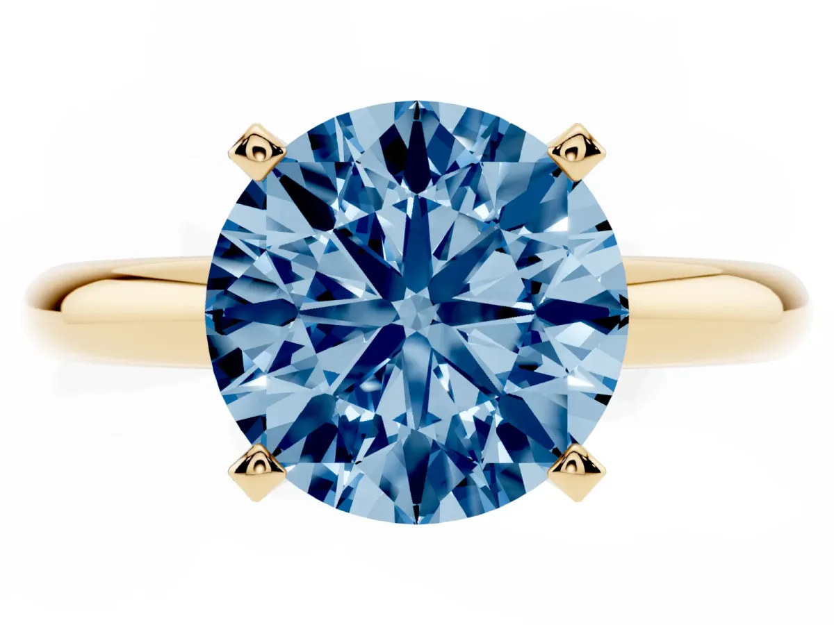 Fancy Blue Round Cut Diamond Solitaire Engagement Ring with Round Band and Four-Prong Setting Yellow gold
