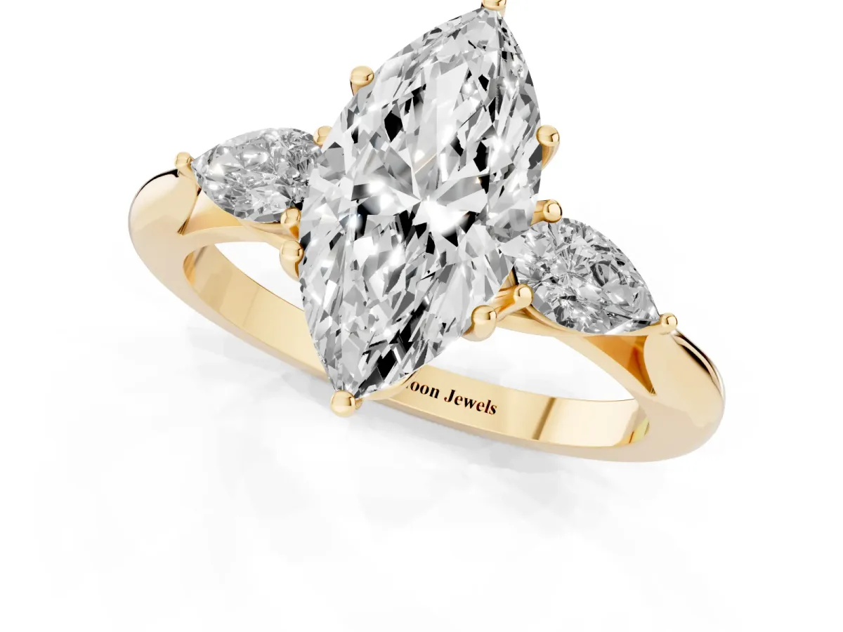 Three-Stone Marquise Cut Brilliant Diamond Solitaire Ring with Tapered Band and Four-Prong Setting Yellow gold