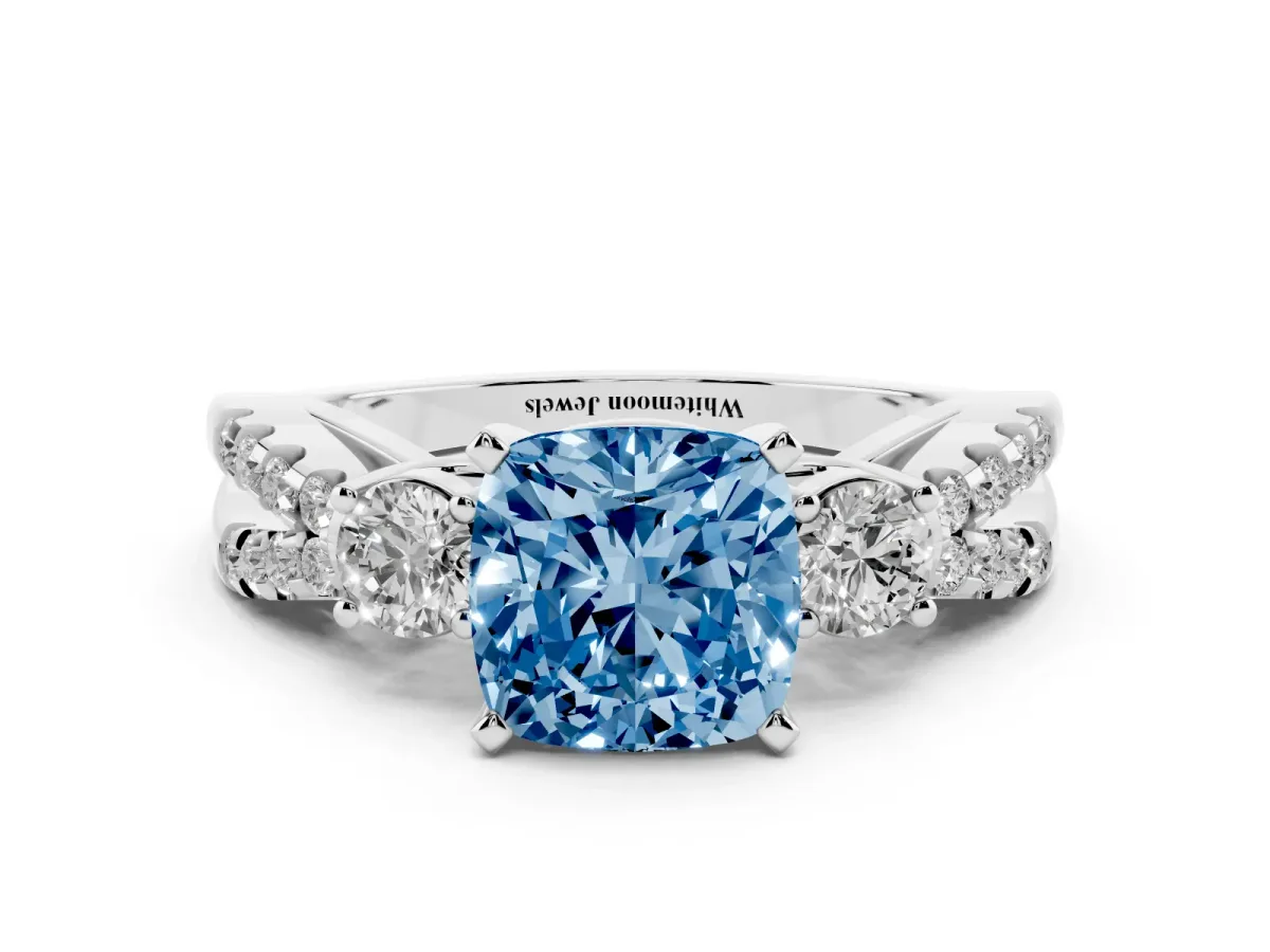 Fancy Blue Cushion Cut Diamond Three-Stone Ring with Pavé Split Shank and Four-Prong Setting Silver