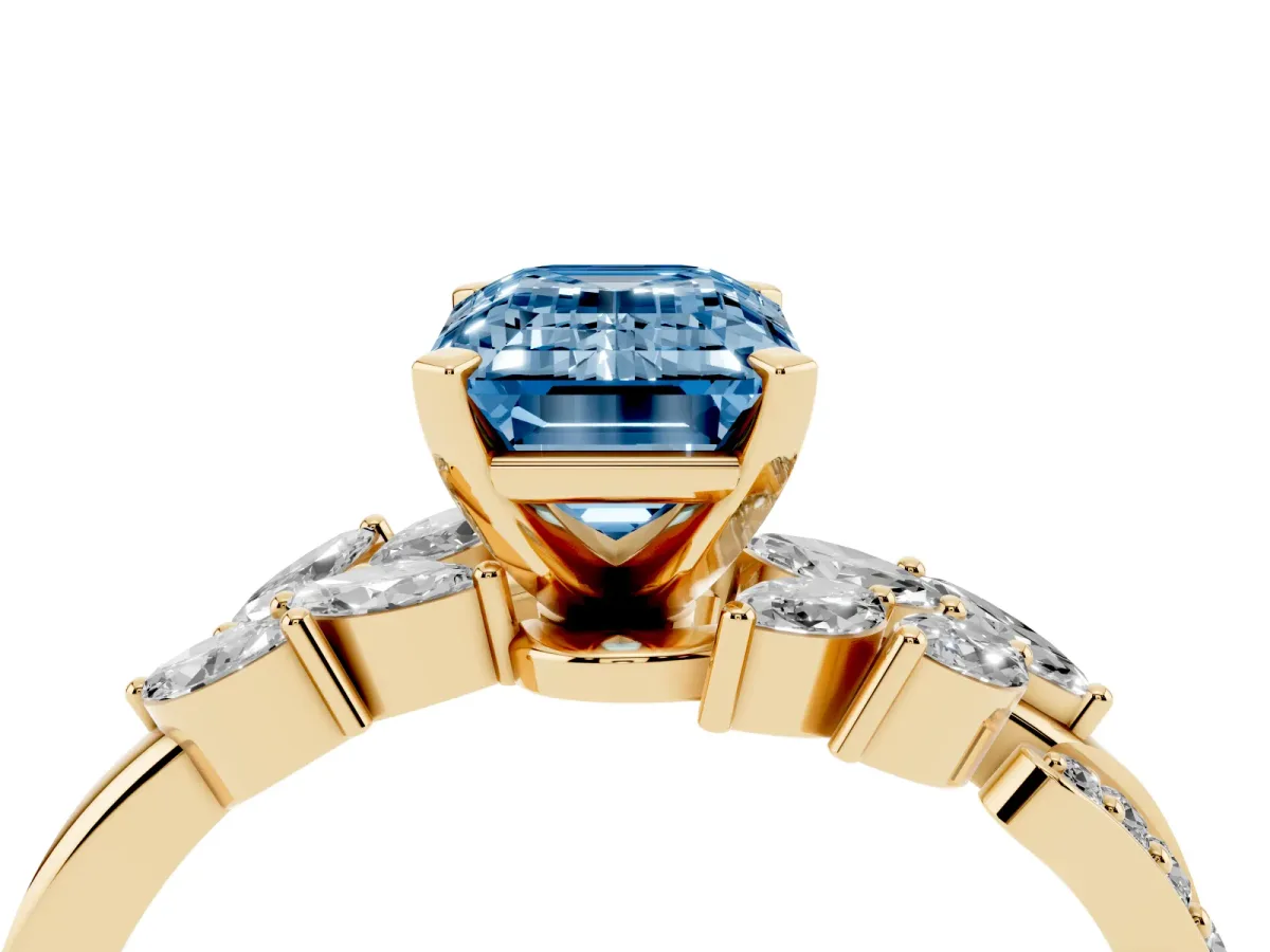Fancy Blue Emerald Cut Solitaire Marquise Twist Band with Six-Prong Setting Yellow gold
