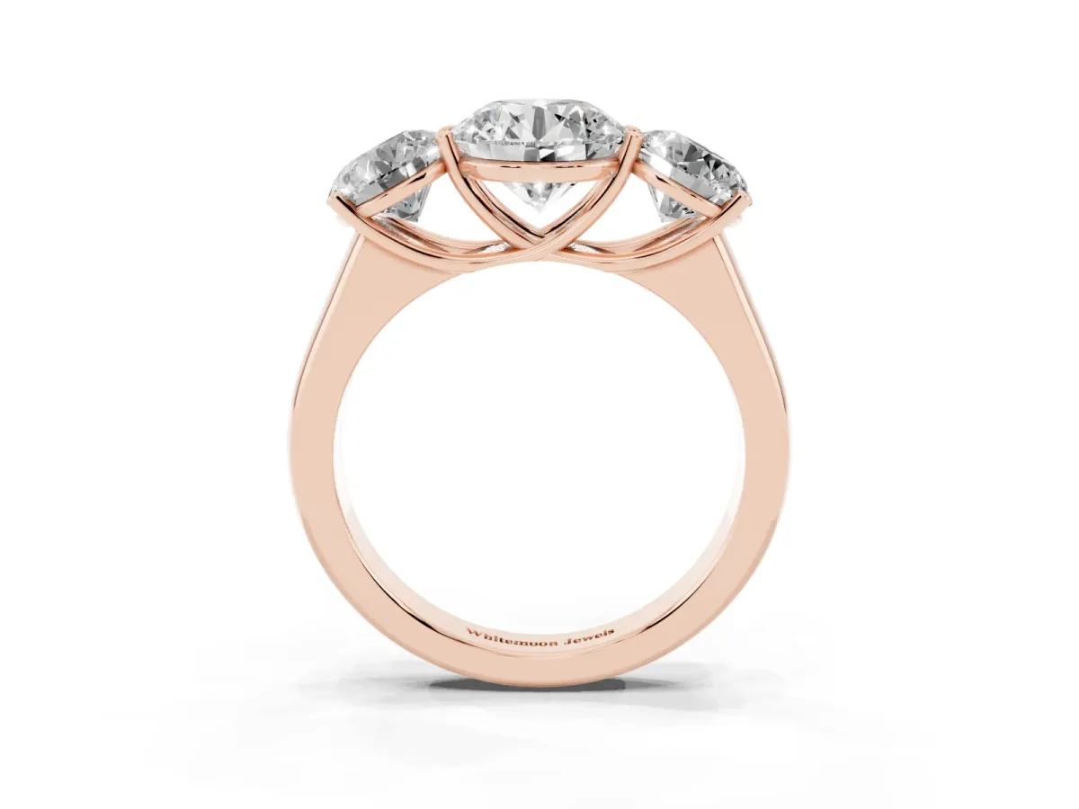 Round Cut Three-Stone Diamond Ring with Prong Setting on a Classic Band Rose gold