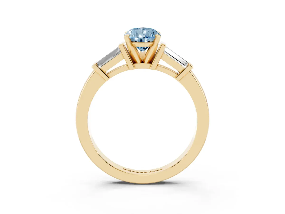 Fancy Blue Pear Cut Cut Diamond Solitaire Ring with Tapered Baguette Accents and Four-Prong Setting Yellow gold