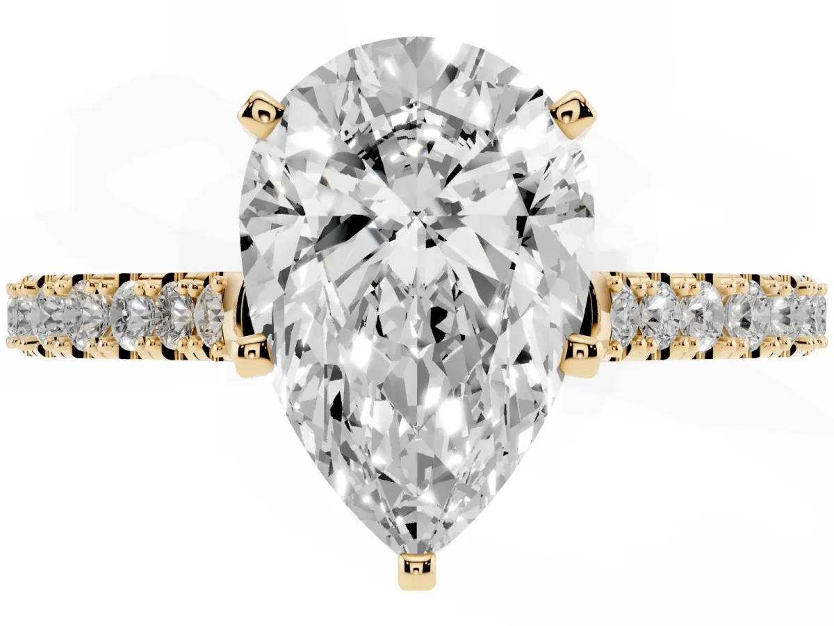 Pear Cut Cut Solitaire Diamond Engagement Ring with Pave Band and Four-Prong Setting Yellow gold