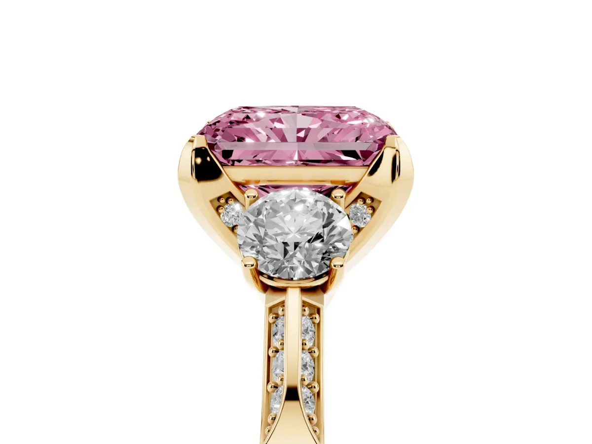 Fancy Pink Radiant Cut Brilliant Three-Stone Diamond Ring with Pavé Band and Four-Prong Setting Yellow gold