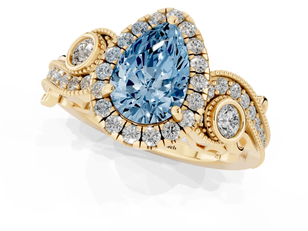 Fancy Blue Pear Cut Halo Diamond Ring with Milgrain and Bezel Accents on a Split Shank Band Yellow gold