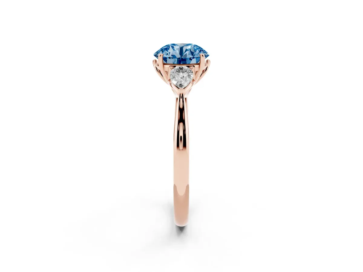 Fancy Blue Round Cut Diamond Three-Stone Ring with Pear Side Stones and Prong Setting Rose gold