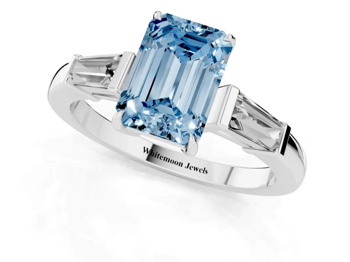 Fancy Blue Emerald Cut Diamond Three-Stone Ring with Tapered Baguette Side Stones and Prong Setting Platinum